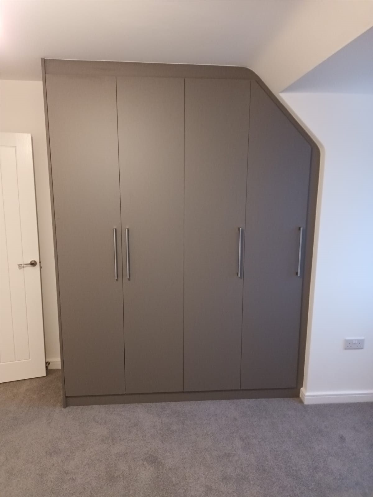 Bespoke fitted media wall by Golden Fitted Wardrobe